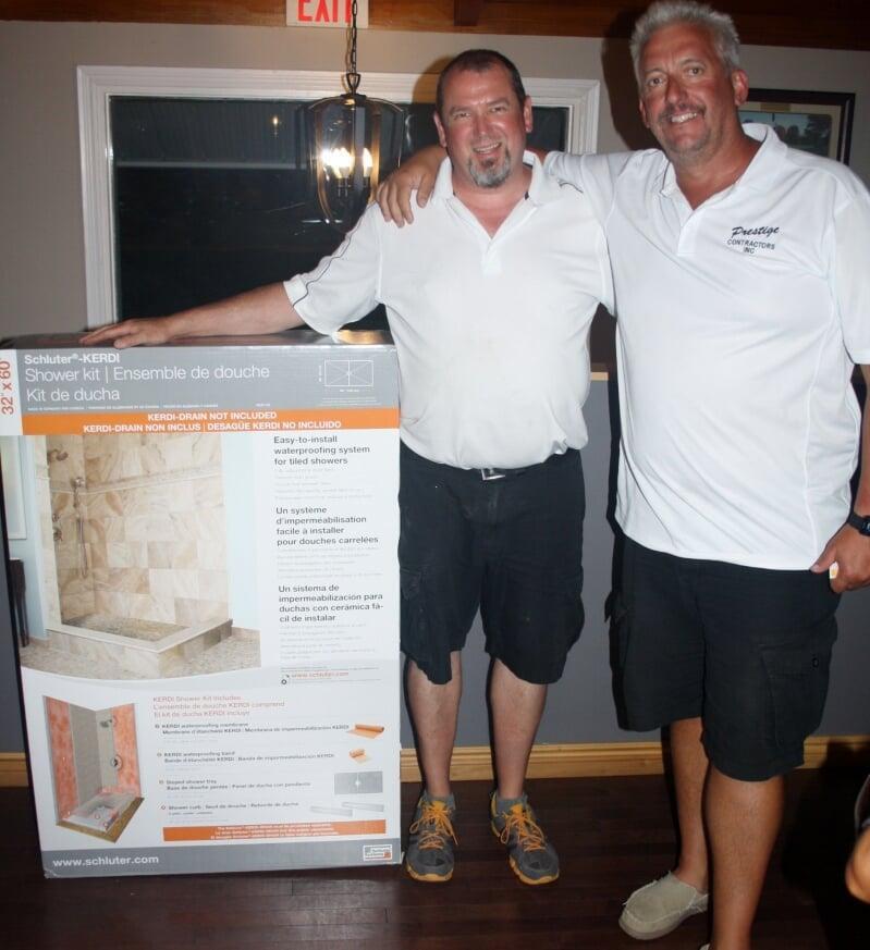 Mark Busscher present Randy Head a Schuter Shower Kit